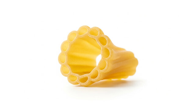 Single piece of uncooked Italian paccheri rigati pasta, a large, ridged tube shape, isolated on a clean white background, ready for cooking and culinary creations.