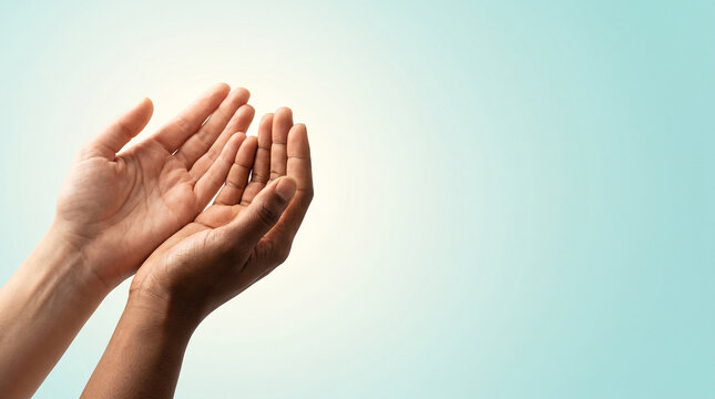 Human rights day concept, diverse cupped hands reaching out for hope and equality on blue copy space