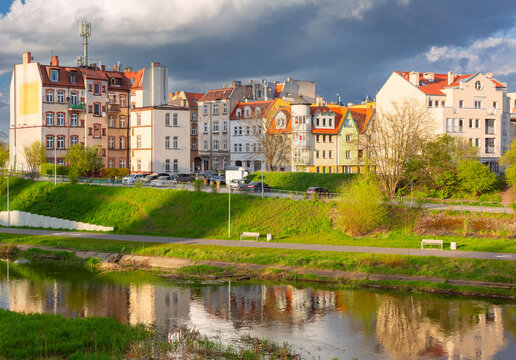 Historic residential buildings of Srodka district along the Warta River in Poznan, Poland.