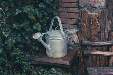 Old Watering can in wooden table  © william