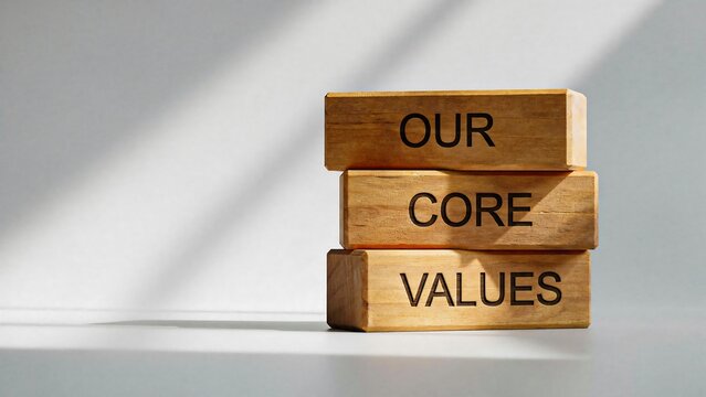 Core values concept with stacked wooden blocks arranged on a minimalist background