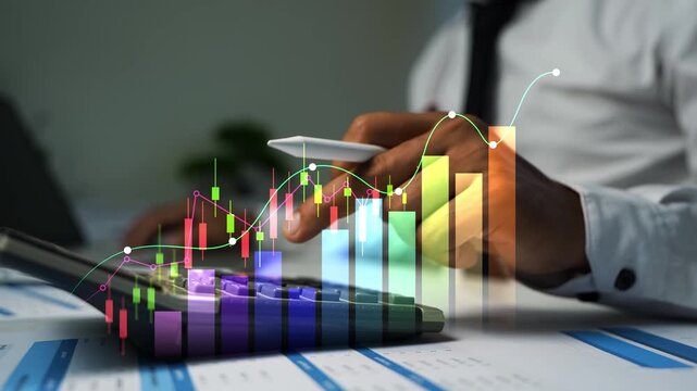 Businessman using a calculator with glowing hologram bar charts and data graphics overlay animation, Business financial growth, analytics, investment planning, and modern office work 