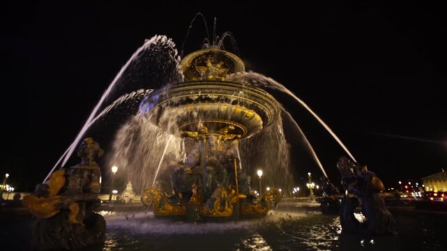 Illuminated Fountain of the Seas at Place de la Concorde at night, Paris
