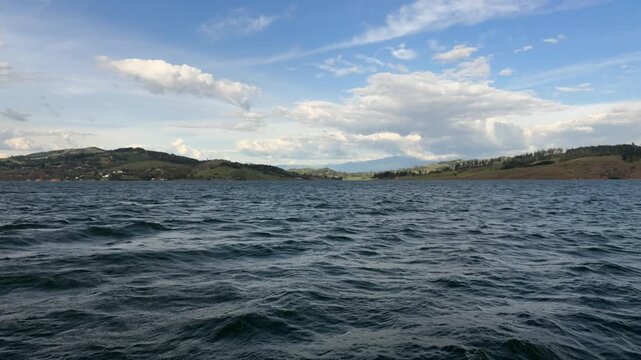 Scenic Lake Calima landscape with mountains and moving water in Colombia