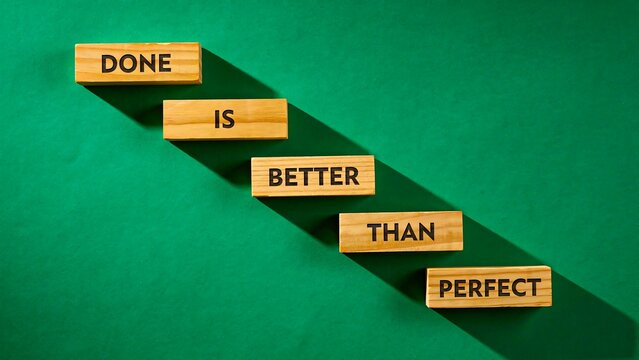Better than perfect concept showing progress, improvement and achievement with wooden blocks