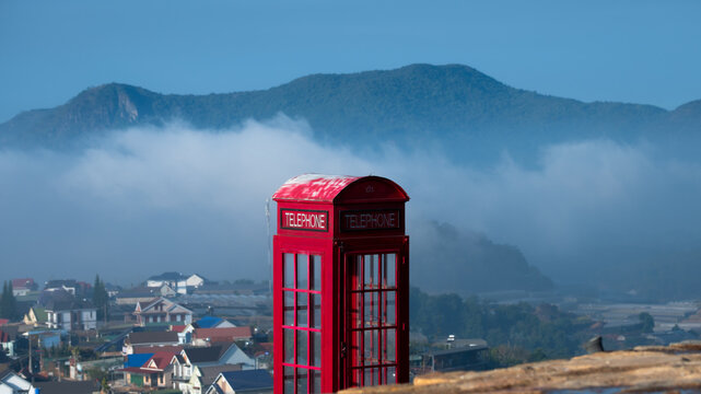 red telephone box in the fog