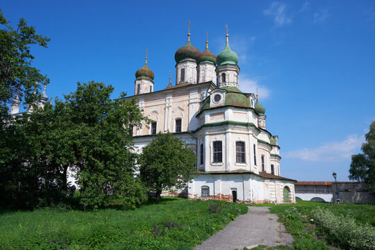 Historic Assumption Cathedral with Weathered White Facade and Green Onion Domes at Goritsky Monastery in Pereslavl-Zalessky, Russia