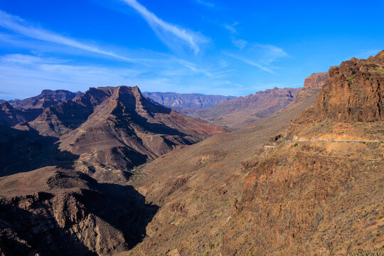 Panorama with mountains and canyon Fataga ravine (Barranco de Fataga) seen from viewpoint Mirador Degollada de las Yeguas on Canary Island Gran Canaria, Spain