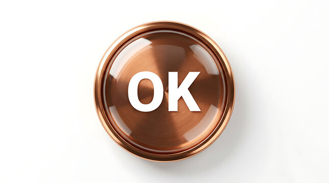 Copper colored button with OK text on surface.