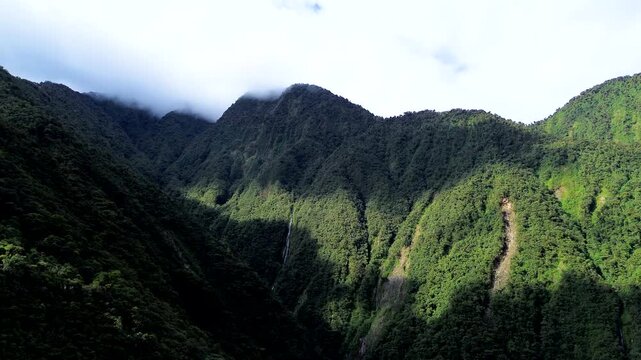 Aerial View of Tropical Mountain Valley in Ecuador with Dense Forest, Green Slopes, Shadowed Canyon and Scenic Andean Amazon Nature Landscape
