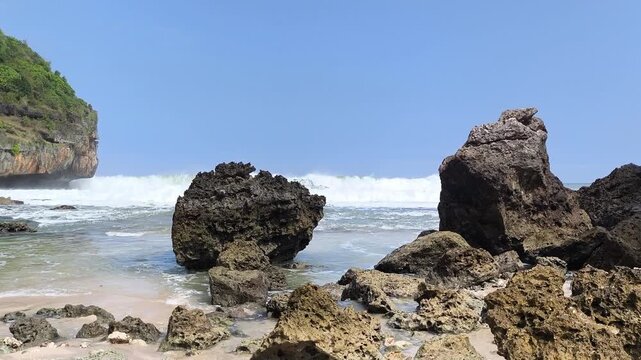 Rugged rocks stand firm against crashing ocean waves