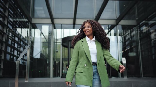 Young African American Woman Leaving Corporate Office Happy After Work