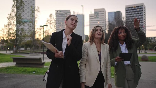 Business women walking and talking about project in the city
