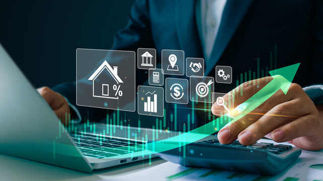 Real estate revenue graph growth. Businessman hand touching on a  graph and growing arrow.Increase asset and profit with house icon, analyzing investment diagram, achievement in business.