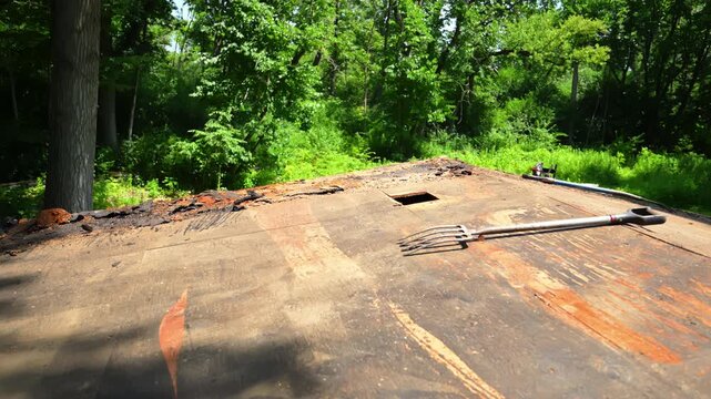 Close up of plywood roof sheathing during a residential roof replacement.