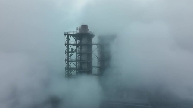 industrial structure in dense fog with visibility changes timelapse