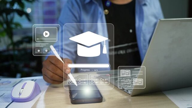 Person using a smartphone and laptop with holographic digital learning icons and graduation cap overlay animation, Online education, remote study, e-learning progress and modern training at office 
