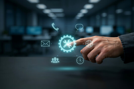 Businessman touching glowing gear and wrench settings icon with communication symbols for IT system technical support
