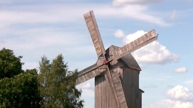 old wooden windmill in the countryside