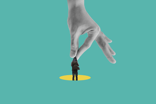Digital collage art, human hanging on hand in yellow hole