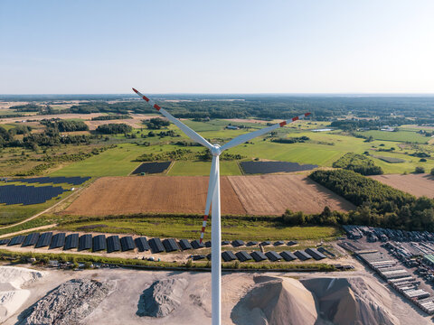 Renewable energy technology installation with green fields