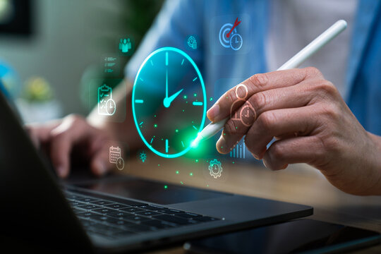 Business professional using stylus on laptop with virtual clock interface and productivity icons, illustrating time management, task scheduling, workflow efficiency, performance optimization concept
