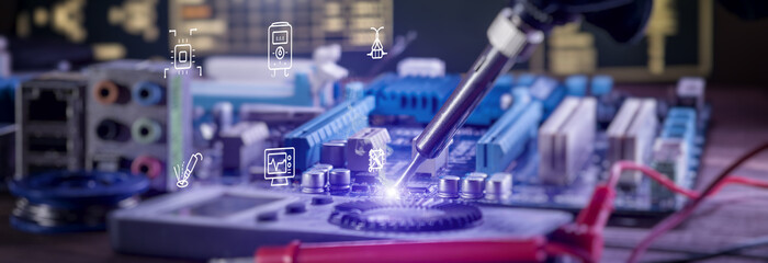 Futuristic electronic repair concept. Soldering iron fixing a computer motherboard with glowing...