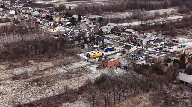 Aerial view of DHL logistics trucks parked in winter conditions 14.01.2026 Poland, Europe