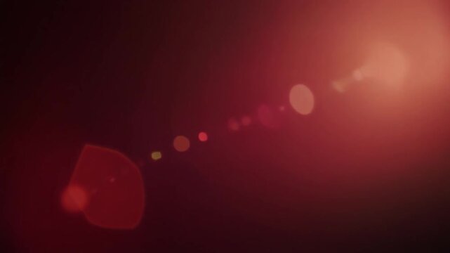 Ruby red cinematic light leak with soft crimson glow