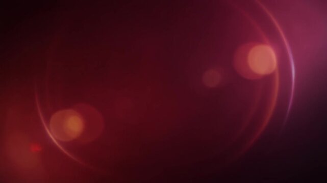 Deep ruby red and crimson light leak blooms across black space with subtle peach gradients, anamorphic lens reflections, optical bloom and soft bokeh for cinematic video overlays.