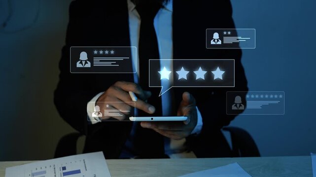 Businessman in a dark office using a tablet with holographic glowing five star rating icons, showing customer review, feedback, online reputation, and service quality concept 