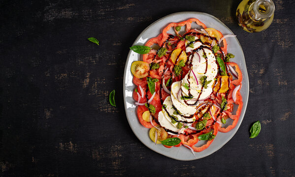 Fresh Mozzarella Salad with Basil Pesto and Balsamic Reduction. Top view