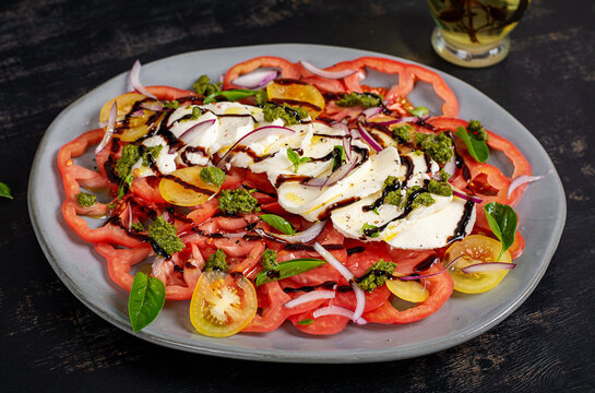 Fresh Italian Caprese Salad with Basil and Pesto Dressing
