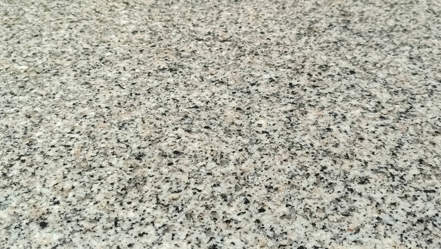 Polished grey and black granite stone slab texture background