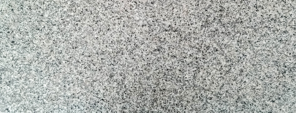 Polished grey and black granite stone slab texture background
