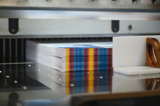 Stacked paper sheets on an industrial paper cutter