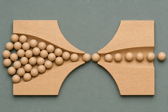 Wooden beads move through narrowing hourglass pathway, illustrating business bottleneck, workflow constraints, process delays, operational inefficiency and restricted productivity in minimalist flat l
