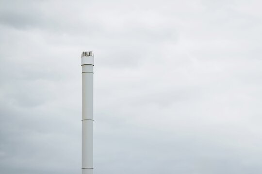White chimney stack on cloudy day