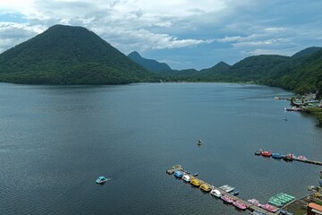 Aerial drone photo of Lake Haruna with pier and pedal boats in Gunma, Japan © AeroSkope