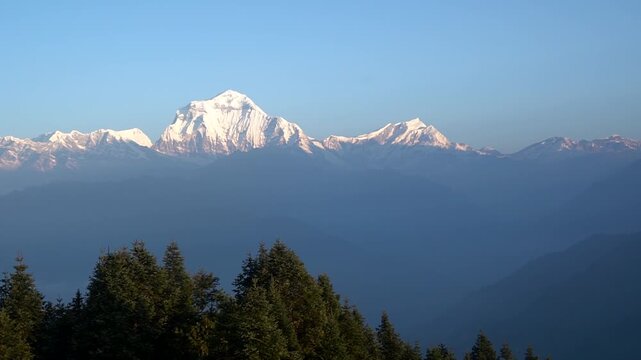 Handheld footage,Landscape nature Mt. Dhaulagiri massif snow mountain with sunrise on himalaya rang mountain in the morning seen from Poon Hill, Nepal -Blue Nature travel and trekking park and outdoor