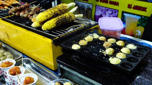 Corn and Skewers Grilling at a Street Food Stall