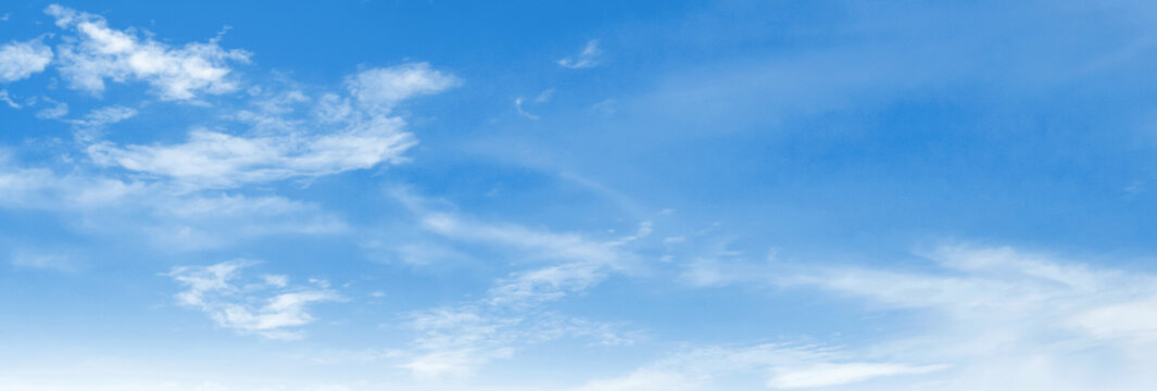 Clear blue sky with wispy clouds