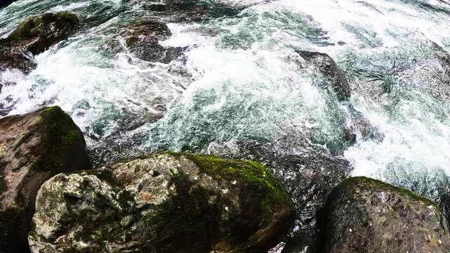 Close View of Rushing Whitewater River Over Rocks in Tropical Ecuador, Freshwater Rapids, Motion Texture and Rainforest Nature Background