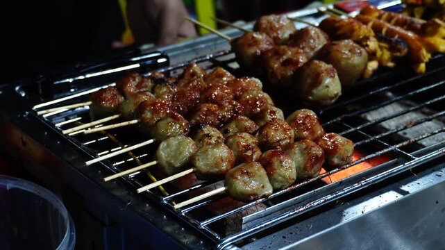 Meatball Skewers Grilling on a Hot Charcoal Grill