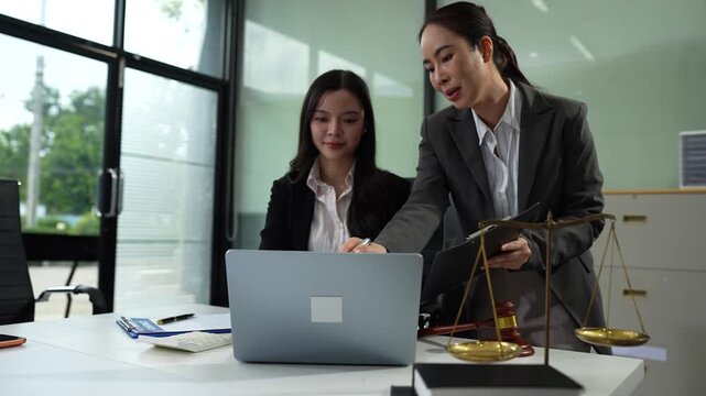 Business people and lawyers discussing contract papers sitting in the table at office in the morning. concepts of law, advice, legal services.