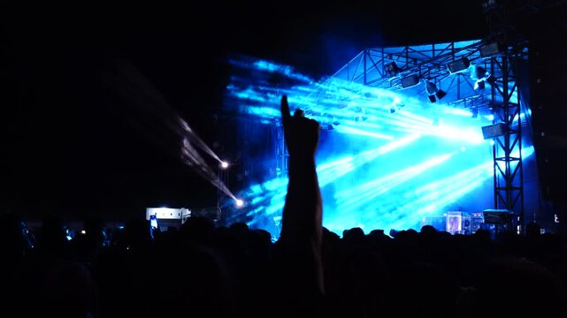 Colorful Laser Lights Over a Night Concert Crowd