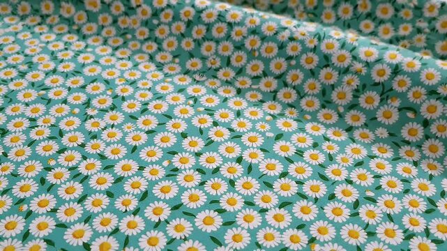 Seamless pattern of small white daisies with yellow centers on a turquoise background, fabric texture, natural floral design