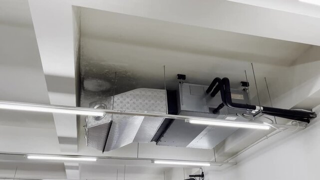 Close up of elegant indoor plasterboard ceiling with bright LED strip lights