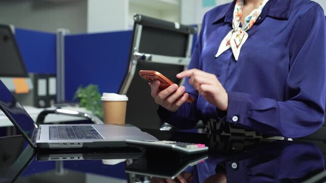 Business woman or financial data analysts working with smartphone and laptop computers and data graphs together. Plan to analyzing projects in the office.