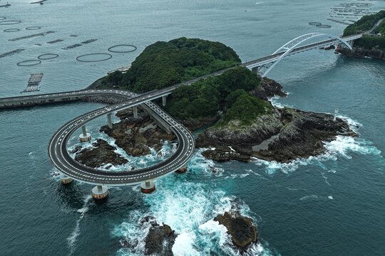 Aerial drone photo of loop bridge and small island coastline in Kushimoto, Wakayama, Japan